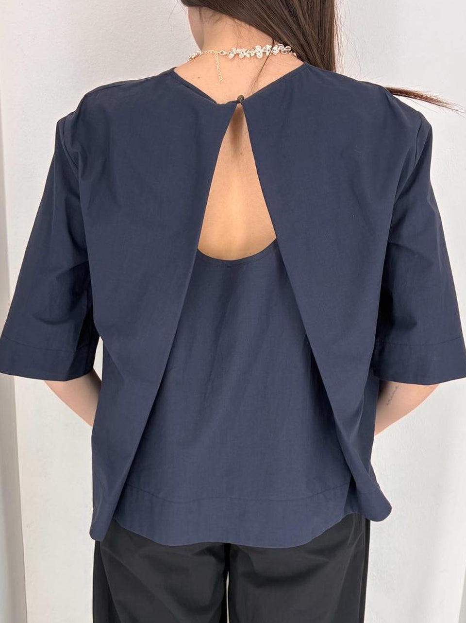 camicia apertura al retro